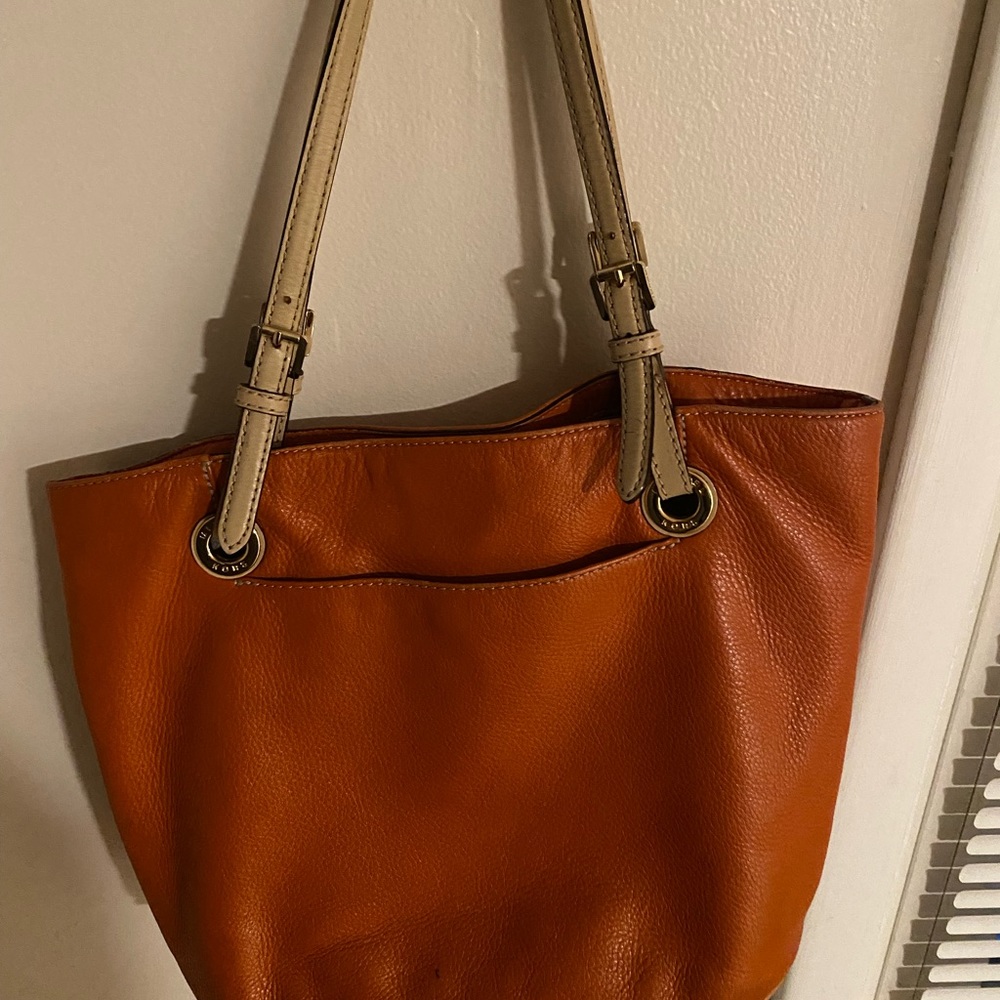 MK bag in orange.